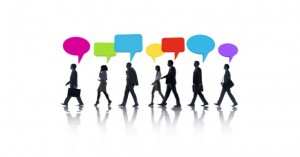 Image of people walking with speech bubbles above their heads